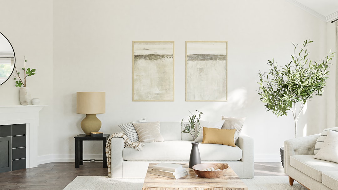 A cozy living room with fresh decor elements, including plants, cushions, and a clean layout.
