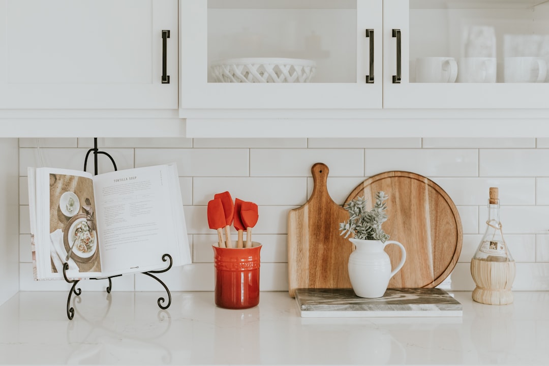 A well-organized small kitchen with efficient storage solutions, showcasing shelves, containers, and a tidy countertop.
